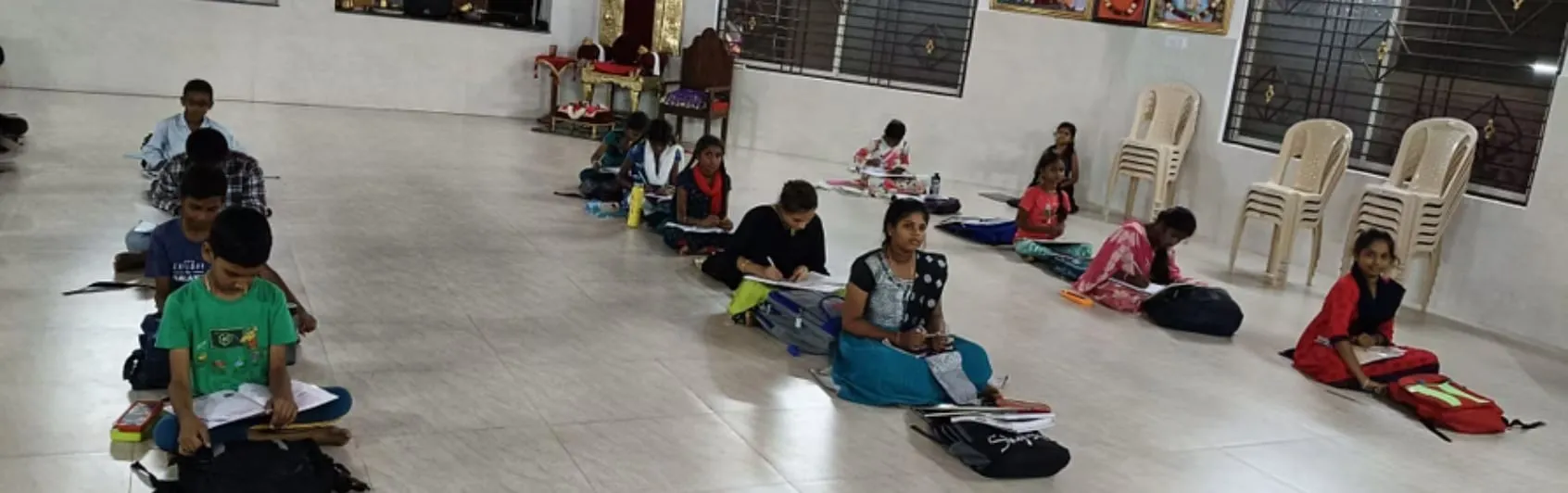 Students working through their books during evening tuition