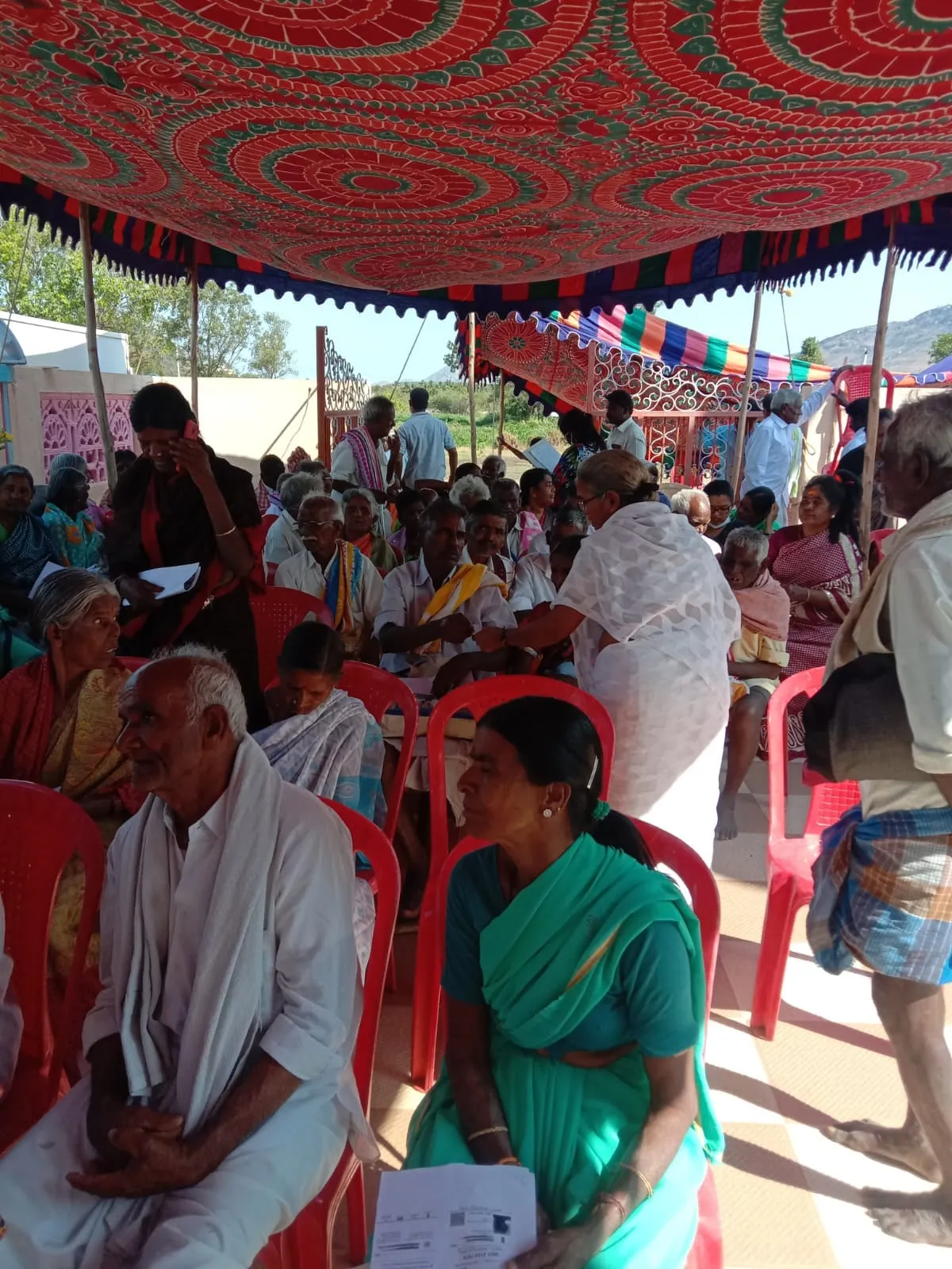 Patients waiting under the canopy at the monthly eye camp