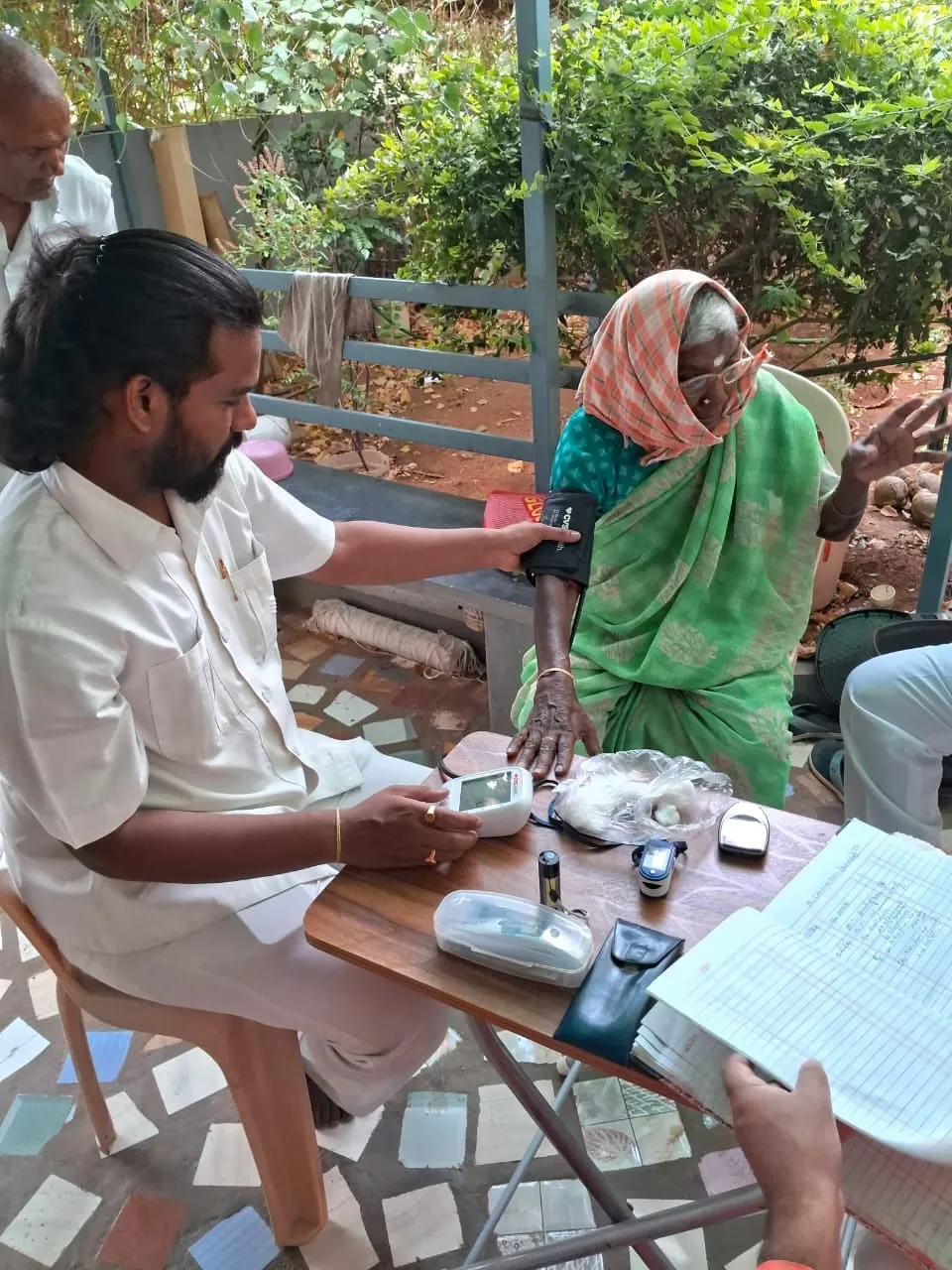 A health check conducted outdoors at the Kuteer