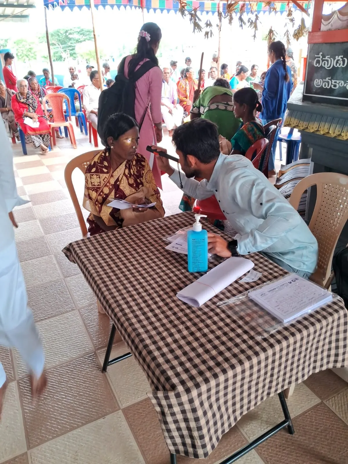 Volunteers registering patients before the camp begins