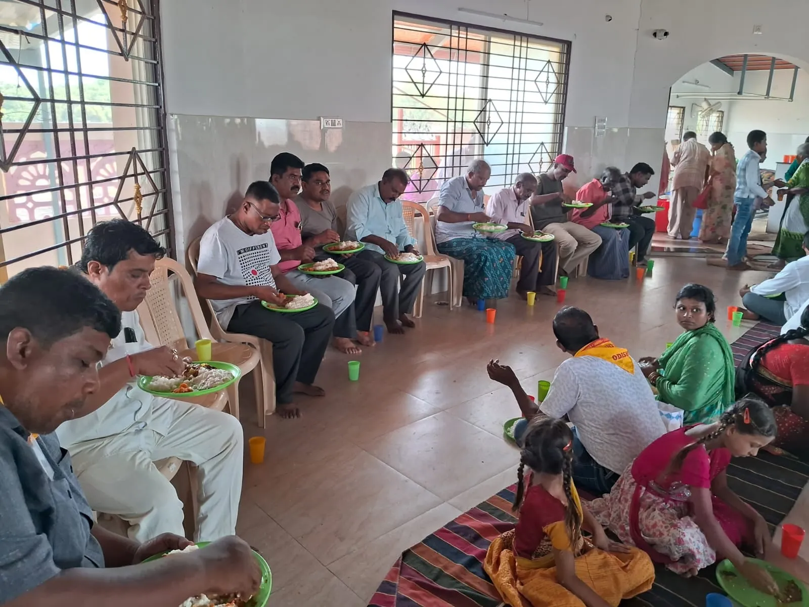 Devotees gathered in the Kuteer hall