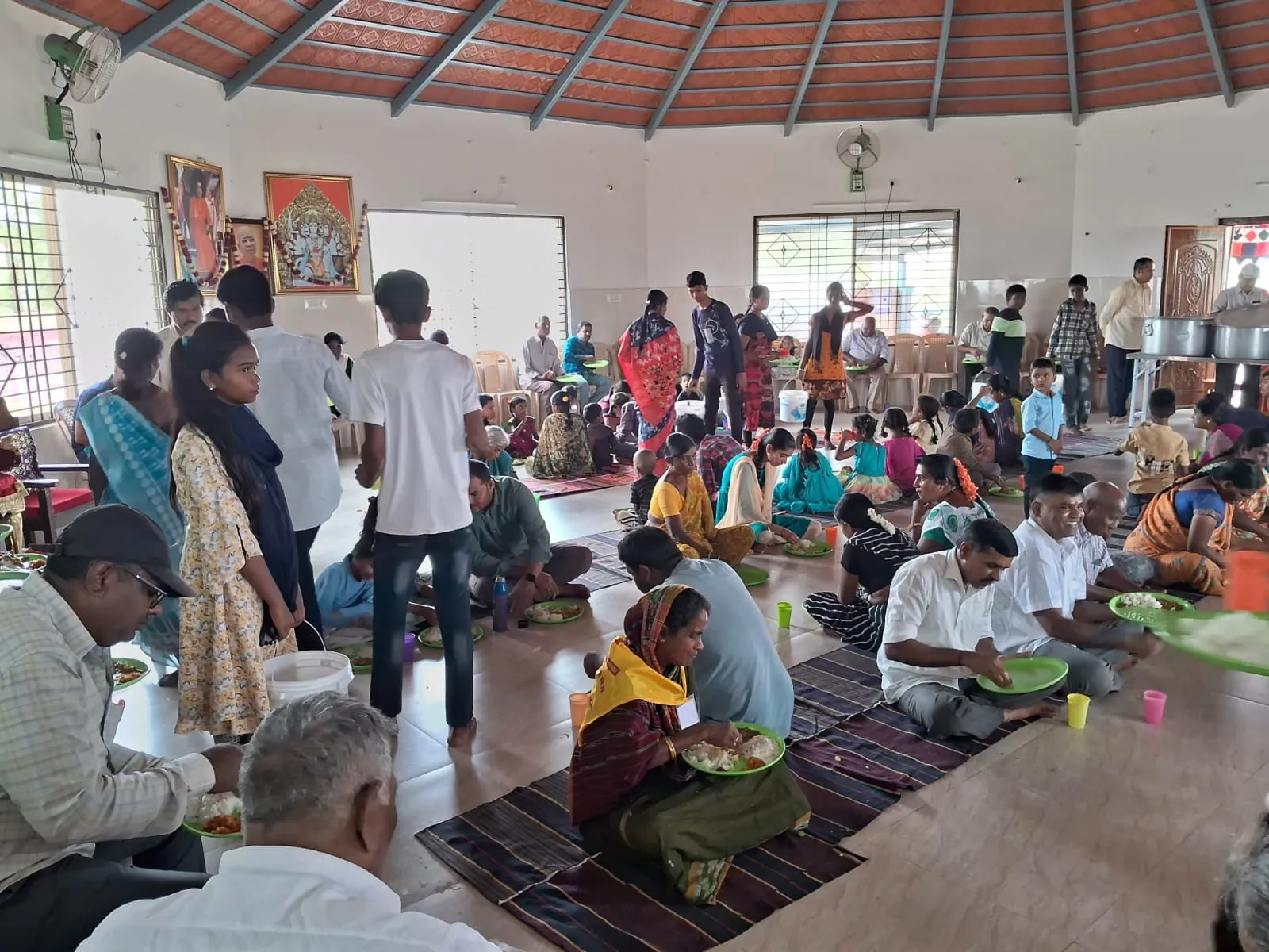 The Kuteer hall filled with guests during the monthly Narayana Seva