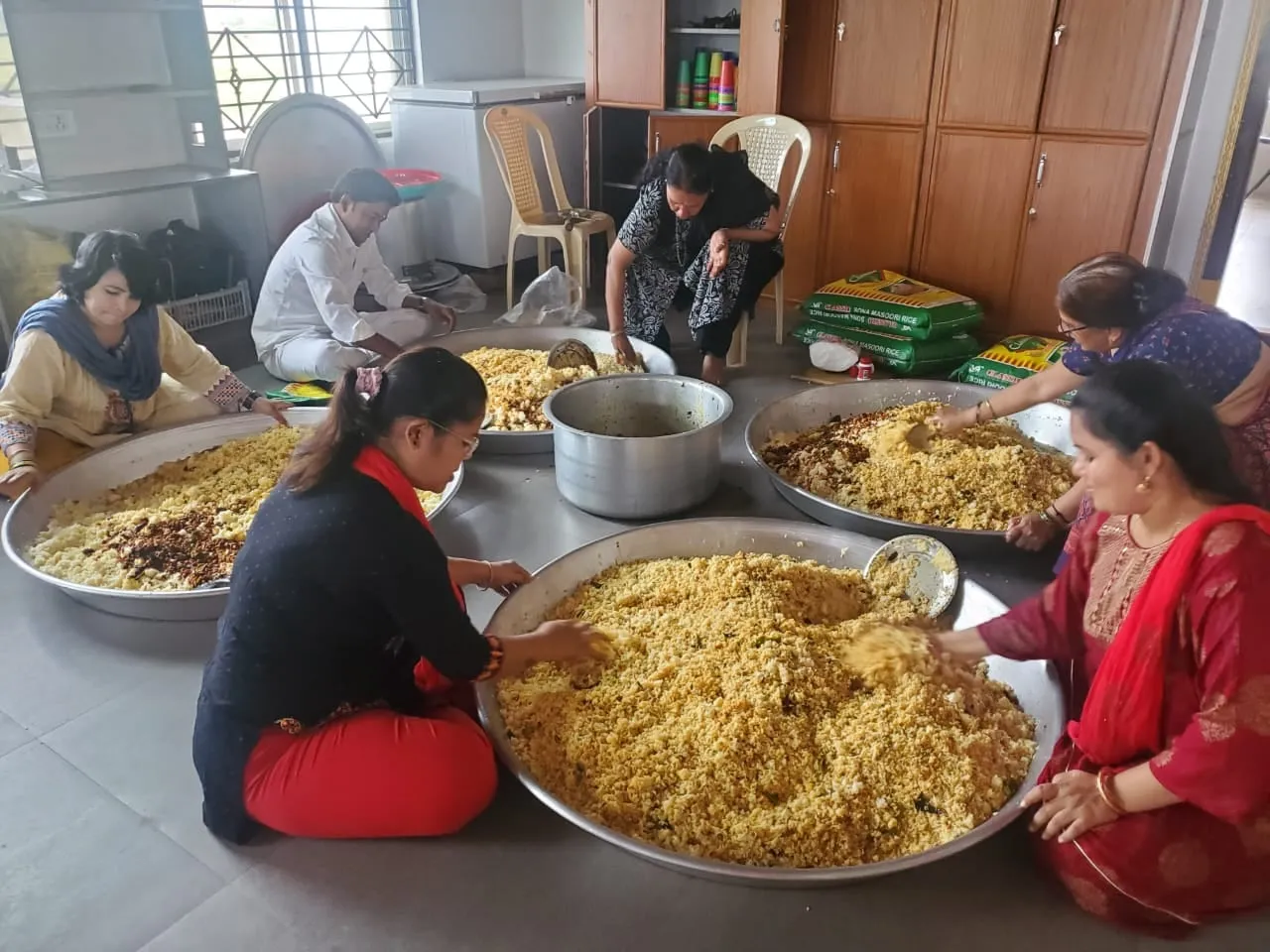 Volunteers portioning rice for the mobile medical camp lunch