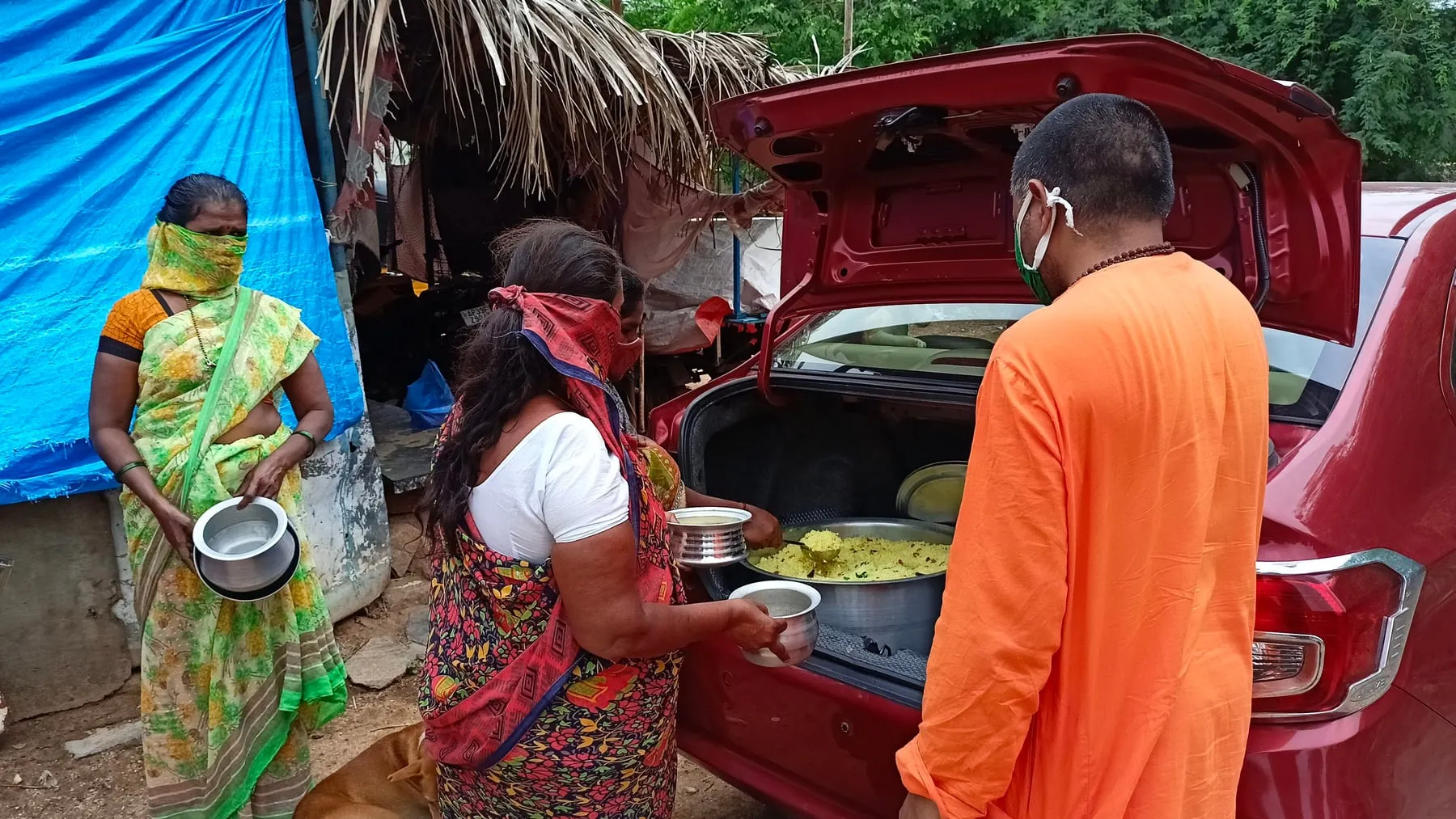 Meals served from the vehicle on the village Narayana Seva round
