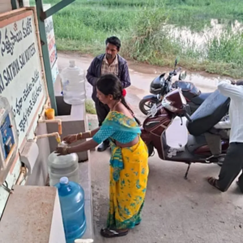 Families collecting free RO-purified drinking water at the Kuteer